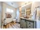 Bathroom featuring hardwood floors, vanity with granite countertop, and modern toilet at 6313 W Paradise Ln, Glendale, AZ 85306