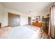 Bright bedroom with wood floors, closet, and natural light from the window at 6313 W Paradise Ln, Glendale, AZ 85306