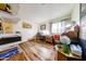 Bedroom featuring hardwood floors, a cozy desk, and a bright window view at 6313 W Paradise Ln, Glendale, AZ 85306