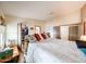 Bedroom featuring hardwood floors, comfortable bed, and natural light from windows at 6313 W Paradise Ln, Glendale, AZ 85306