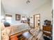 Bedroom featuring hardwood floors, comfortable bed, and natural light from windows at 6313 W Paradise Ln, Glendale, AZ 85306