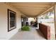 Covered patio with ample seating, perfect for outdoor dining and entertaining guests at 6313 W Paradise Ln, Glendale, AZ 85306
