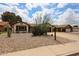Charming single-story home with desert landscaping and a spacious driveway at 6313 W Paradise Ln, Glendale, AZ 85306
