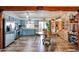 Eat-in kitchen with blue cabinets, stainless appliances, and wood beam accents at 6313 W Paradise Ln, Glendale, AZ 85306