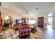 Cozy living room with vaulted ceilings, wood floors, and an abundance of natural light at 6313 W Paradise Ln, Glendale, AZ 85306