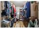 Walk-in closet with hardwood floors, built-in shelving, and plenty of storage space at 6313 W Paradise Ln, Glendale, AZ 85306