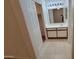Neutral bathroom featuring a single sink vanity, tile floors, and a closet with a sliding door at 6784 W Gardenia Ave, Glendale, AZ 85303