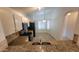 Modern kitchen featuring granite countertops, tile backsplash, and black appliances, with an adjacent dining area at 6784 W Gardenia Ave, Glendale, AZ 85303