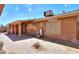 Backyard with paved patio, desert landscaping, and exterior view of the home at 7038 W Fillmore St, Phoenix, AZ 85043