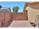 Enclosed backyard with a brick wall and a wooden gate, offering a private outdoor space at 7038 W Fillmore St, Phoenix, AZ 85043
