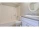 Bathroom featuring a shower-tub combo and a vanity at 7038 W Fillmore St, Phoenix, AZ 85043