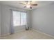 Bedroom featuring a ceiling fan and a window providing great natural light at 7038 W Fillmore St, Phoenix, AZ 85043