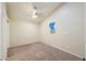 Carpeted bedroom featuring a ceiling fan and window air conditioner at 7038 W Fillmore St, Phoenix, AZ 85043