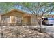 Charming single-story home with a mature tree and landscaping in a residential neighborhood at 7038 W Fillmore St, Phoenix, AZ 85043