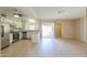 Open kitchen with white cabinets, stainless steel appliances, and a view of the backyard at 7038 W Fillmore St, Phoenix, AZ 85043