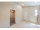 View of the kitchen featuring tile floors and ceiling fan with doorway to an adjacent bedroom at 7038 W Fillmore St, Phoenix, AZ 85043