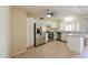 Modern kitchen with white cabinets, stainless steel appliances, and granite countertops at 7038 W Fillmore St, Phoenix, AZ 85043