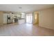 Open floor plan kitchen with stainless appliances, tile floors and granite countertop island at 7038 W Fillmore St, Phoenix, AZ 85043