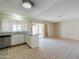 Bright kitchen with white cabinets, granite countertops, and stainless steel appliances at 7038 W Fillmore St, Phoenix, AZ 85043