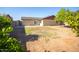 Spacious backyard with mature tree, block fence and ample space for outdoor activities at 7136 W Cheryl Dr, Peoria, AZ 85345