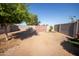 Large, level backyard with block fencing, suitable for various outdoor activities at 7136 W Cheryl Dr, Peoria, AZ 85345