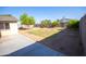 Wide backyard with block fence and concrete patio, ideal for entertaining at 7136 W Cheryl Dr, Peoria, AZ 85345
