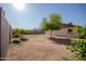 Large backyard with trees, block fence and potential for landscaping at 7136 W Cheryl Dr, Peoria, AZ 85345