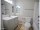 Inviting bathroom with a gray vanity, a tub, and modern fixtures, all in a neutral color palette at 7136 W Cheryl Dr, Peoria, AZ 85345