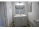 Stylish bathroom with a gray vanity, a modern mirror, and a walk-in shower area at 7136 W Cheryl Dr, Peoria, AZ 85345