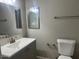 Clean bathroom with new vanity, mirror and lighting at 7136 W Cheryl Dr, Peoria, AZ 85345