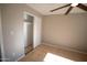 Cozy bedroom with tile flooring and standard closet at 7136 W Cheryl Dr, Peoria, AZ 85345