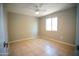 Bright bedroom with tile flooring and natural light through window at 7136 W Cheryl Dr, Peoria, AZ 85345