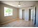 Bedroom features tile flooring and ample natural light from window at 7136 W Cheryl Dr, Peoria, AZ 85345