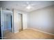 Bedroom with tile flooring, closet and access to bathroom at 7136 W Cheryl Dr, Peoria, AZ 85345