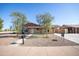 Charming single-story home with a well-manicured front yard and a spacious driveway at 7136 W Cheryl Dr, Peoria, AZ 85345