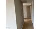 Hallway with tile flooring, neutral walls, and lighting at 7136 W Cheryl Dr, Peoria, AZ 85345