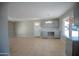 Open concept living room with tile flooring, neutral walls, and a large window for natural light at 7136 W Cheryl Dr, Peoria, AZ 85345