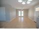 Open living area with tile floors, a ceiling fan, and a sliding glass door that leads outdoors at 7136 W Cheryl Dr, Peoria, AZ 85345