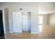 Open-concept living space with tile flooring and storage closet near backyard access at 7136 W Cheryl Dr, Peoria, AZ 85345