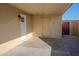 Covered patio area with white doors and neutral walls, ideal for outdoor living at 7136 W Cheryl Dr, Peoria, AZ 85345