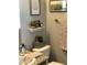 Charming bathroom featuring unique wall decorations and a cozy ambiance with earth tone decor at 8700 E University Dr # 124, Mesa, AZ 85207