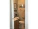 Charming bathroom featuring unique wall decorations and a cozy ambiance with earth tone decor at 8700 E University Dr # 124, Mesa, AZ 85207