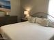Bedroom featuring a cozy bed with decorative pillows and a dresser with lamps at 8700 E University Dr # 124, Mesa, AZ 85207