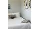 Comfortable bedroom featuring unique wall decorations and a cozy ambiance with gray wall color at 8700 E University Dr # 124, Mesa, AZ 85207