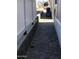 Exterior walkway with pavers and side wall at 8700 E University Dr # 124, Mesa, AZ 85207