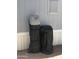 Exterior shot of an ECOWATER filtration system, with black covers, standing next to the house at 8700 E University Dr # 124, Mesa, AZ 85207
