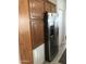 A well-equipped kitchen featuring wood cabinets and a modern stainless steel refrigerator at 8700 E University Dr # 124, Mesa, AZ 85207
