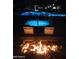An inviting outdoor pool area with illuminated water and lounge chairs, perfect for evening relaxation at 8700 E University Dr # 124, Mesa, AZ 85207