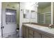 Bathroom featuring double sinks, tiled countertop, and a shower at 880 W Moon Shadow Dr, Casa Grande, AZ 85122