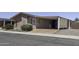 Charming single-story home with a covered carport, driveway, and desert landscaping at 880 W Moon Shadow Dr, Casa Grande, AZ 85122